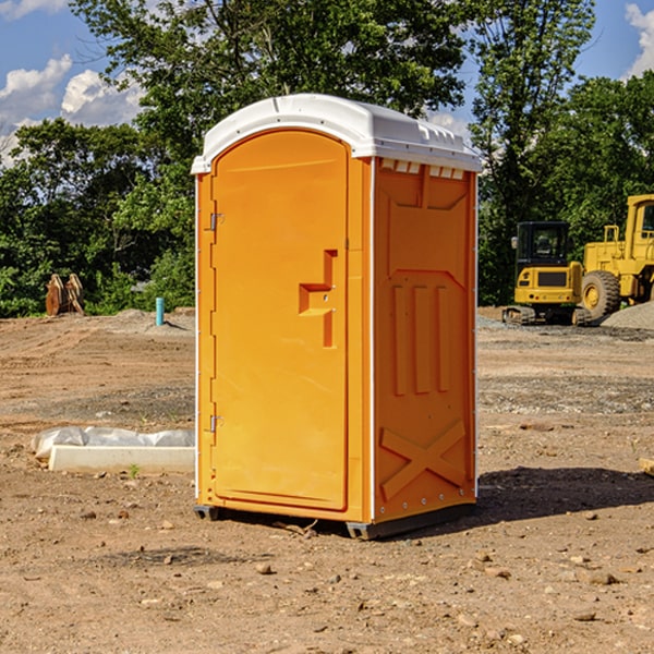 what is the cost difference between standard and deluxe portable toilet rentals in Ossian